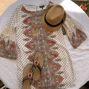 Luxology print dress with bell sleeves.